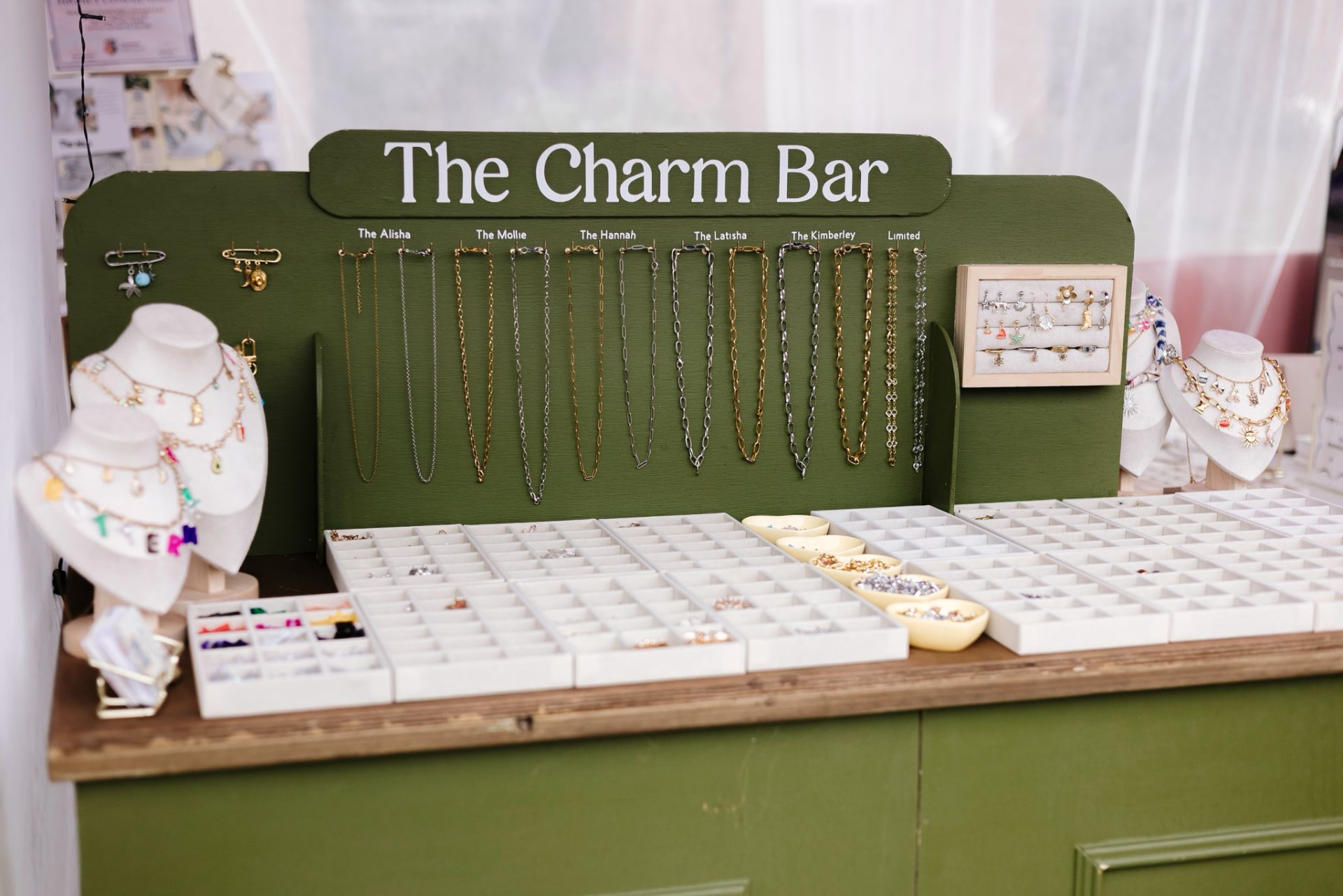 Guests choosing charms at a Buttermelle Charm Bar event