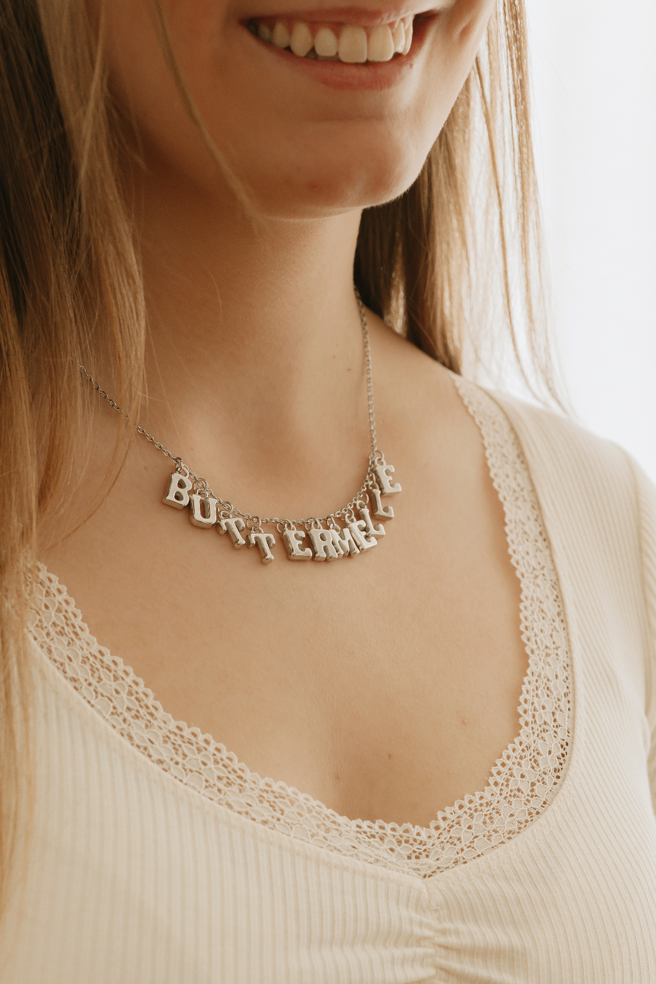 Buttermelle charm-letter necklace worn